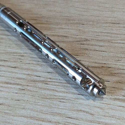 Mini tactical pen with titanium frame like new