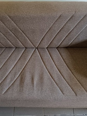 Two-seater sofa bed with storage space