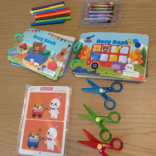 Busy books, Crayola scissors, find the differences sheets, and crayons like new
