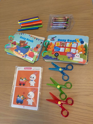 Busy books, Crayola scissors, find the differences sheets, and crayons like new