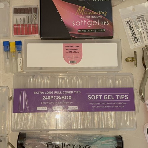 Nail products set like new with dual forms, tips, and accessories