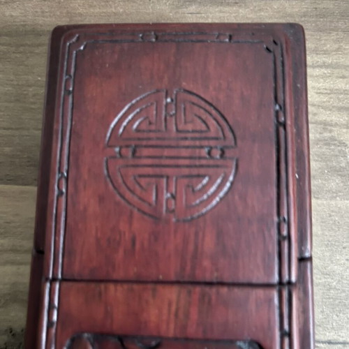 Japanese wooden box with 16 used chopsticks and palm carving