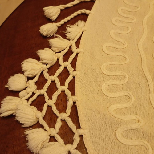 Vintage round tablecloth 81x87 with embossed cordonetto and tassels, used