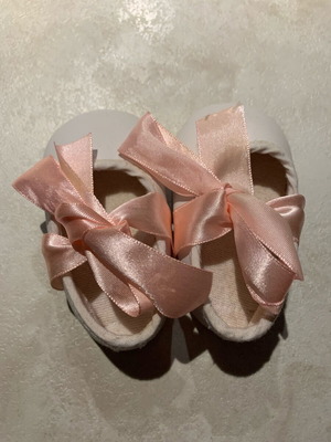 Baby ballet shoes tied with ribbon used for girl