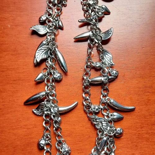 Silver Charm Necklace like new, long with leaf and drop pendants