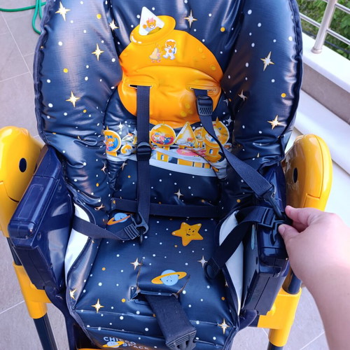 High chair used with plastic tear and stickers