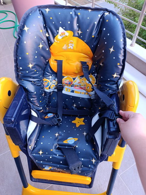 High chair used with plastic tear and stickers