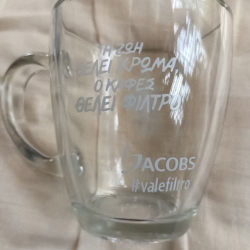 Jacobs glass coffee mug with porcelain saucer