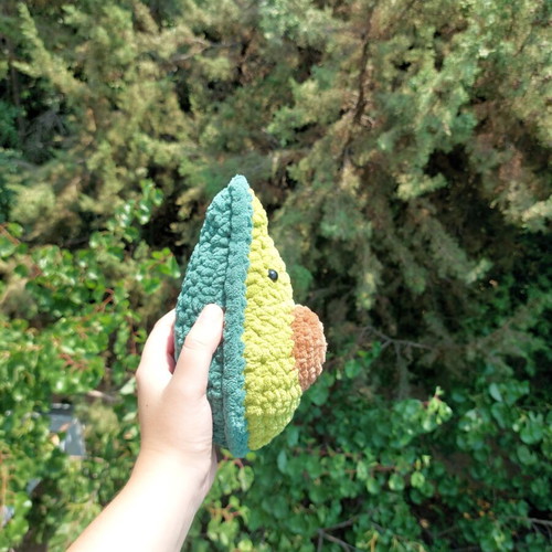 Handmade knitted avocado toy with pit
