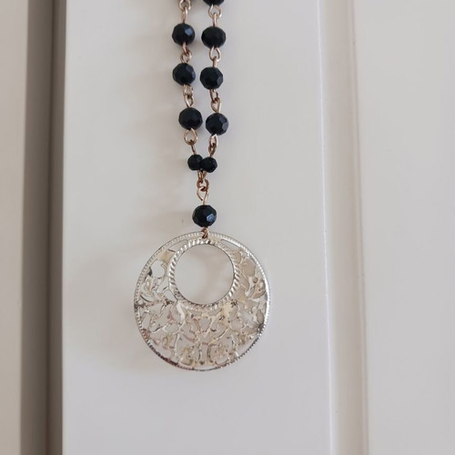 Rosary-style necklace like new with black beads and silver pendant