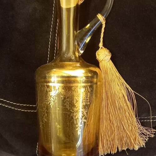 Vintage decorative glass jug with gold decoration and tassel