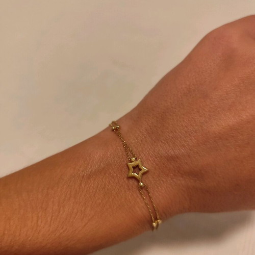 Gold star bracelet 14 karat new, gold color