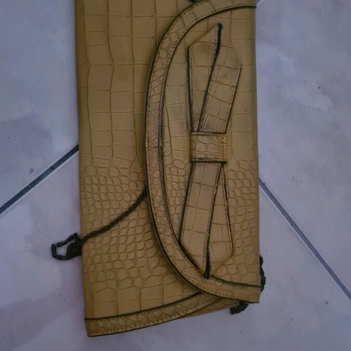 Mustard clutch bag used with minor damages