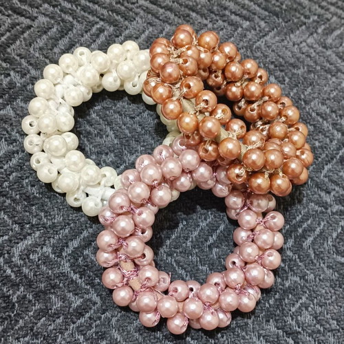 Hair ties new with beads in three colors