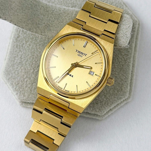 Tissot PRX Quartz watch with golden dial