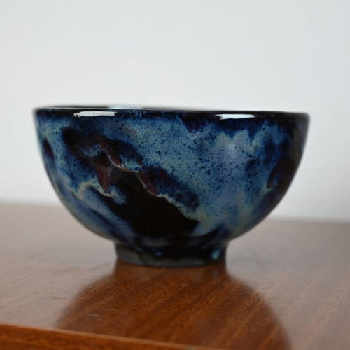Ceramic bowl used with blue glazed surface