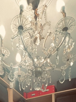 Vintage crystal chandelier used with gold details