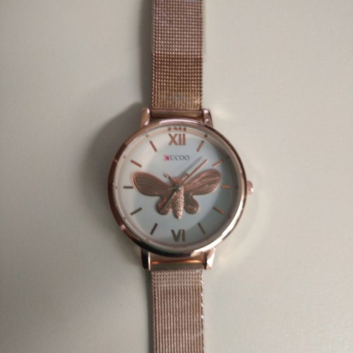 Women's watch new with embossed gold butterfly, pink-gold color