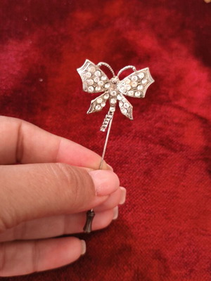 Vintage bow pin brooch with clear rhinestones used, silver color