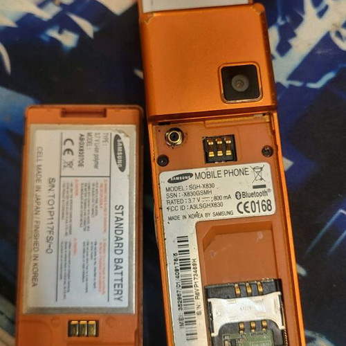 Samsung SGH-X830 used orange phone with charger