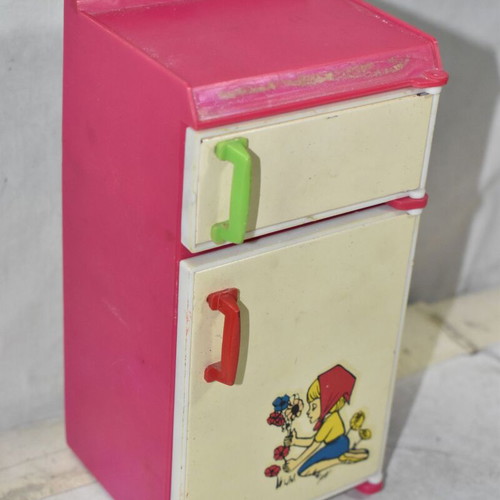Retro children's kitchen fridge used, plastic and metal with illustration