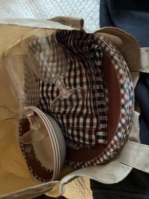 Picnic set like new with tablecloth, plates, bowls, napkins, tote bag, glasses, wooden chopping board