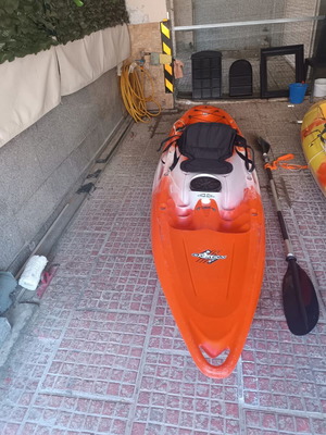 Feel Free Nomad orange kayak like new with paddle and seat