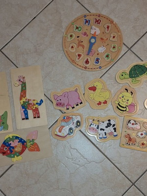Wooden puzzles used, set of 15, one painted clock