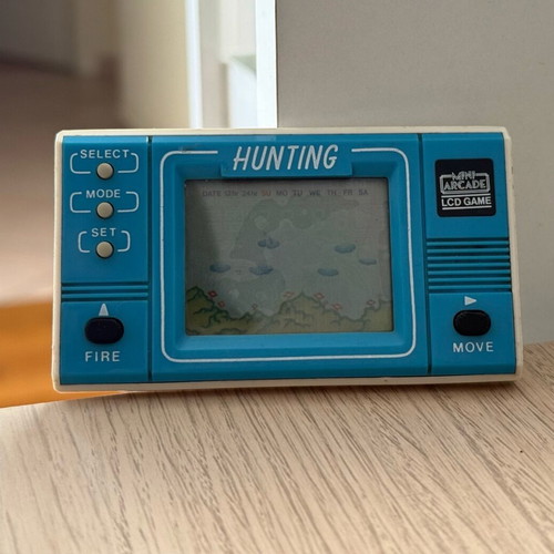 Mini retro arcade handheld console used without cover