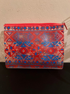 Vichy toiletry bag used, transparent with blue and red patterns