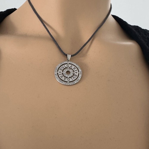 Bvlgari necklace with leather cord gray like new