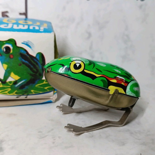 Tin wind-up frog in its box.