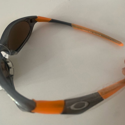 Oakley sunglasses, orange with gold lime chameleon lenses