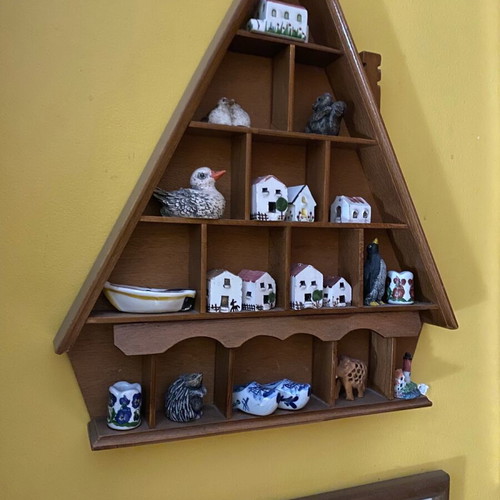 Decorative wall shelf with miniature collection case used