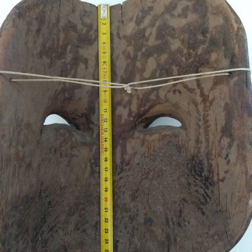 Handmade wooden mask used with aged patina