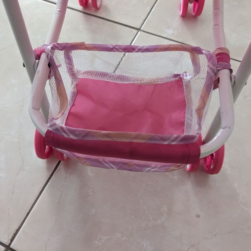 Doll stroller used with wear and fabric tears