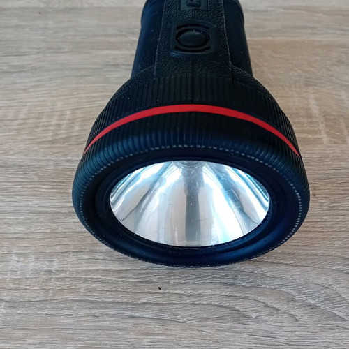 Handheld flashlight used