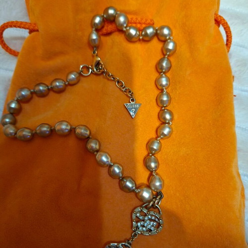 Guess necklace like new, gold color, with orange pouch