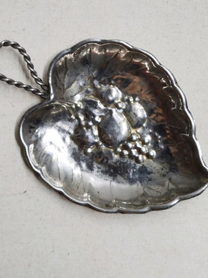 Vintage silver plated leaf-shaped plate used with embossed design