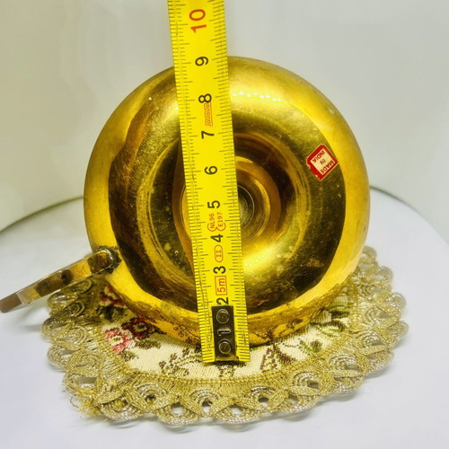 Vintage brass candlestick with handle and drip plate, used