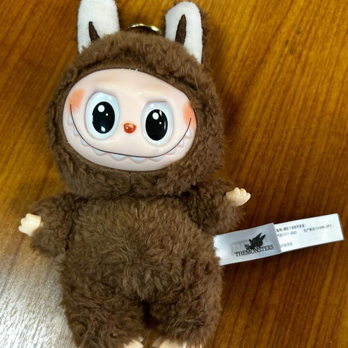 Labubu used brown figure from Pop Mart Monsters series