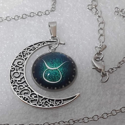 Pendant necklace with Taurus zodiac and crescent moon, like new