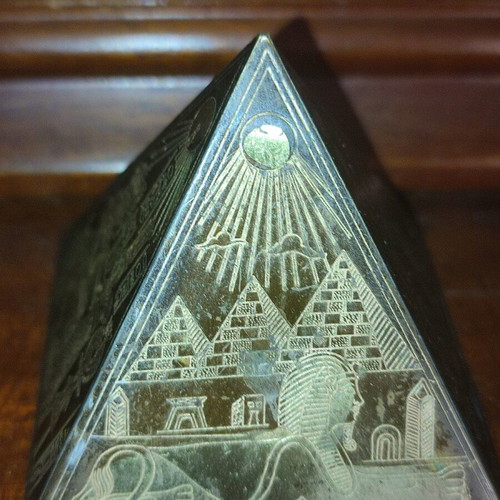 Small antique pyramid with Egyptian gold-plated brass miniatures used