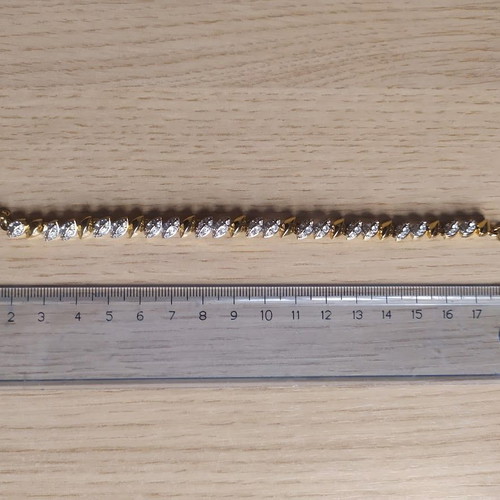 Swarovski bracelet like new, gold tone with crystals