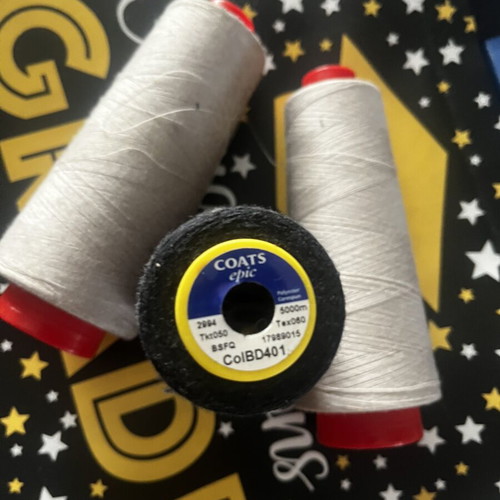 Sewing threads like new, three pieces, two ecru and one black