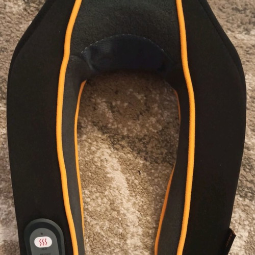 Neck massager used with adjustable intensity and heat function