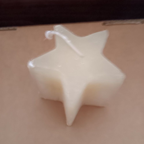 Star-shaped candle used, good condition