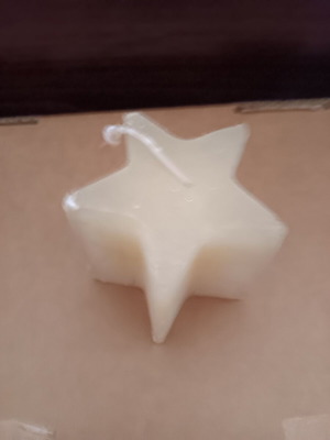 Star-shaped candle used, good condition