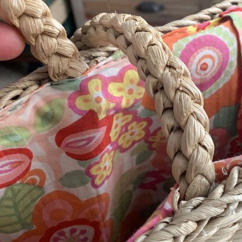 Straw bag like new with braided handles and colorful fabric lining
