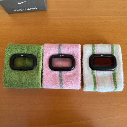Nike sports watch used with white, green and pink wristband